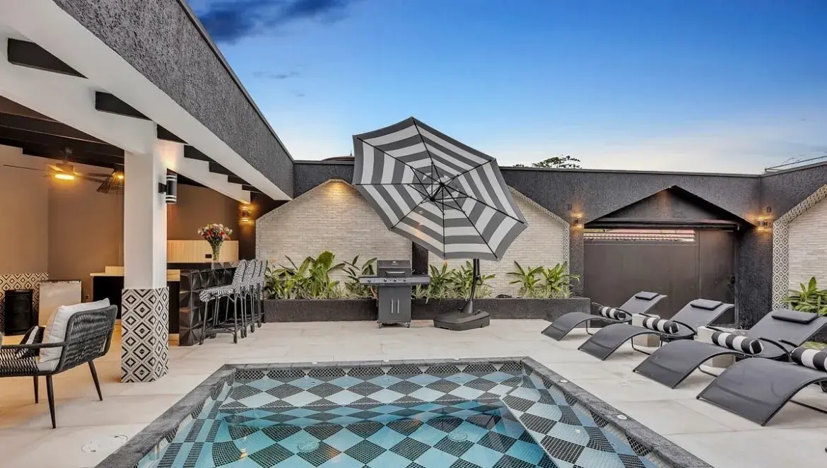 Villa Black & White private infinity-edge pool with checkered black and white patio in Jaco Beach