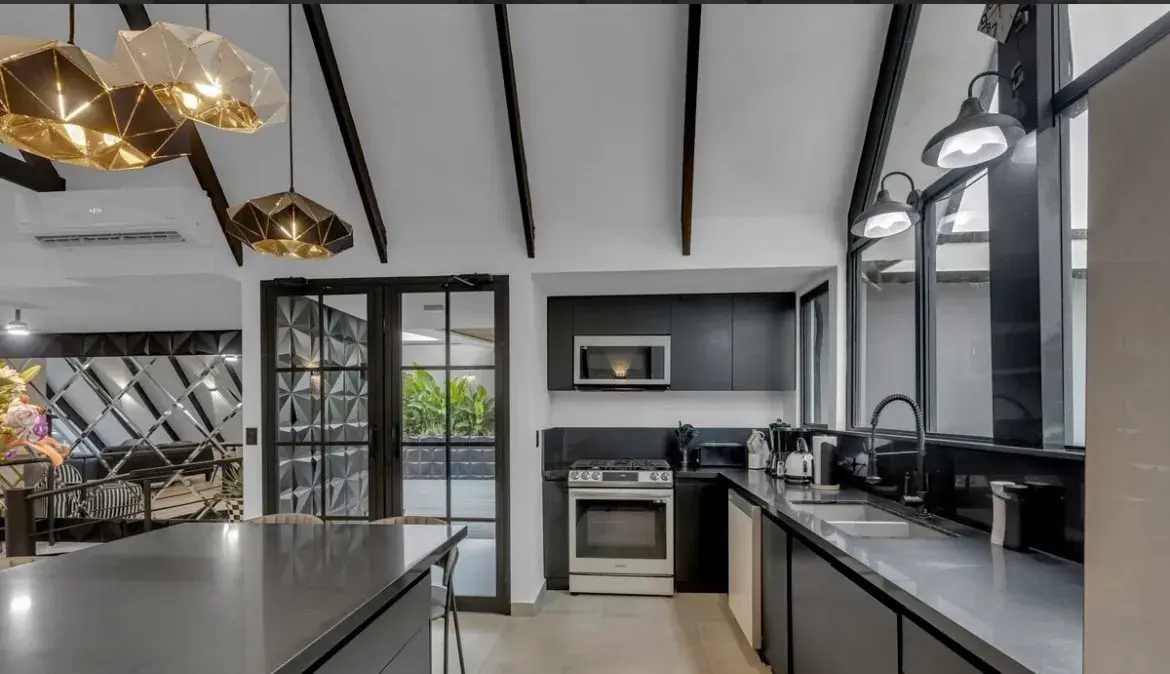 Villa Black & White modern kitchen with large island