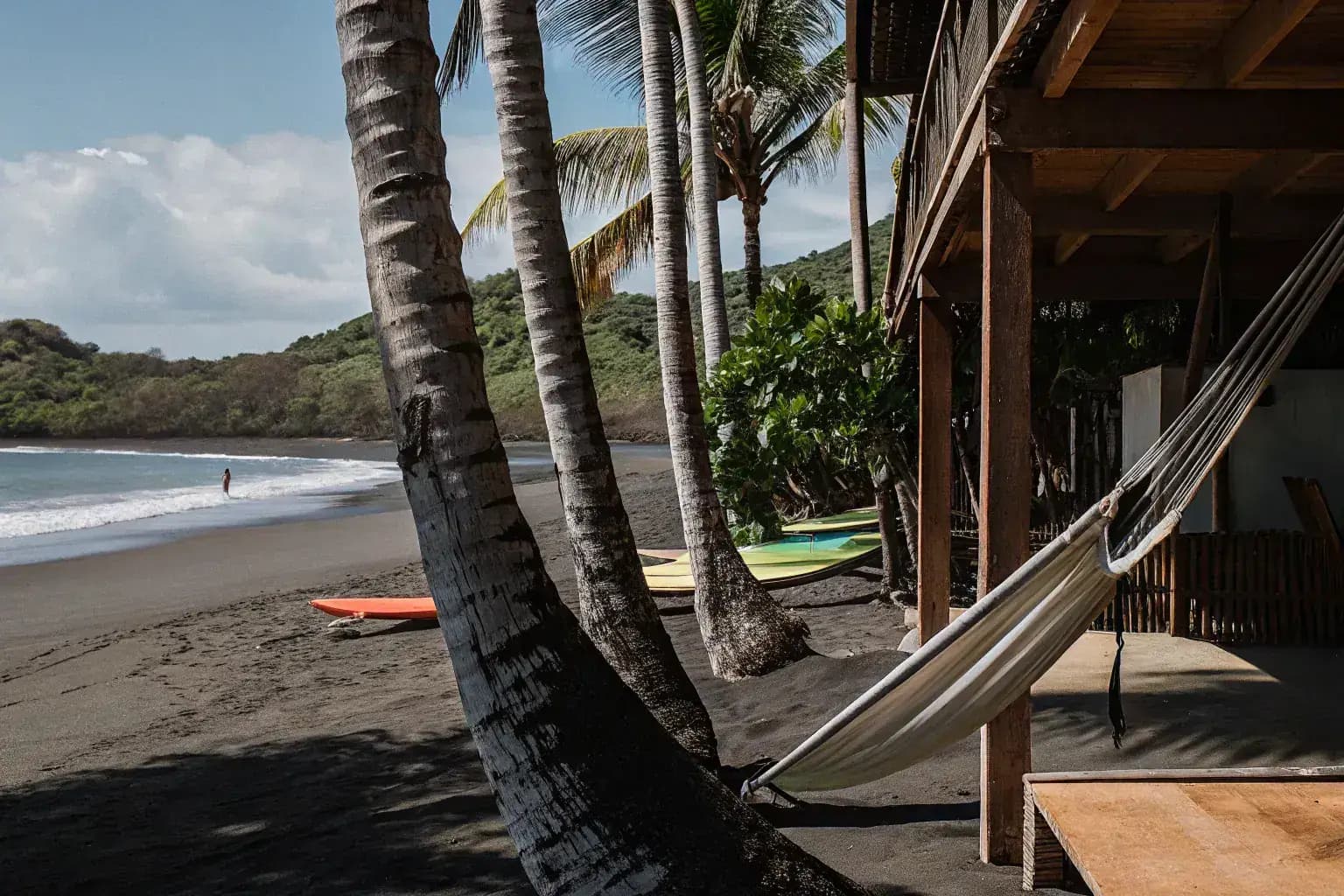 Jaco Beach Costa Rica - surfboards and hammock at the shoreline