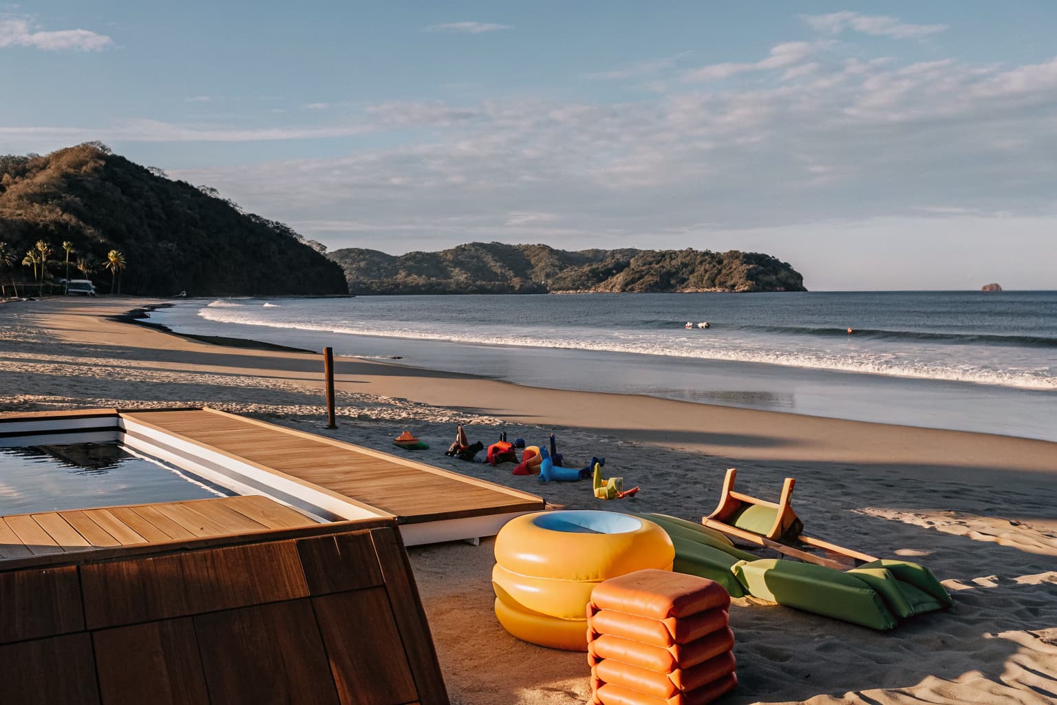 Jaco family vacation beach scene with colorful floats and toys on Jaco Beach Costa Rica