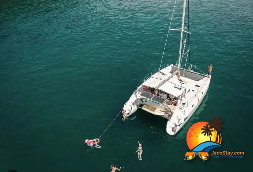 Luxury catamaran sailing the Pacific coast of Costa Rica at golden hour
