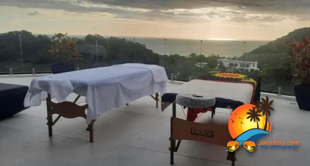 Side-by-side spa massage tables on an outdoor terrace at sunset in Costa Rica