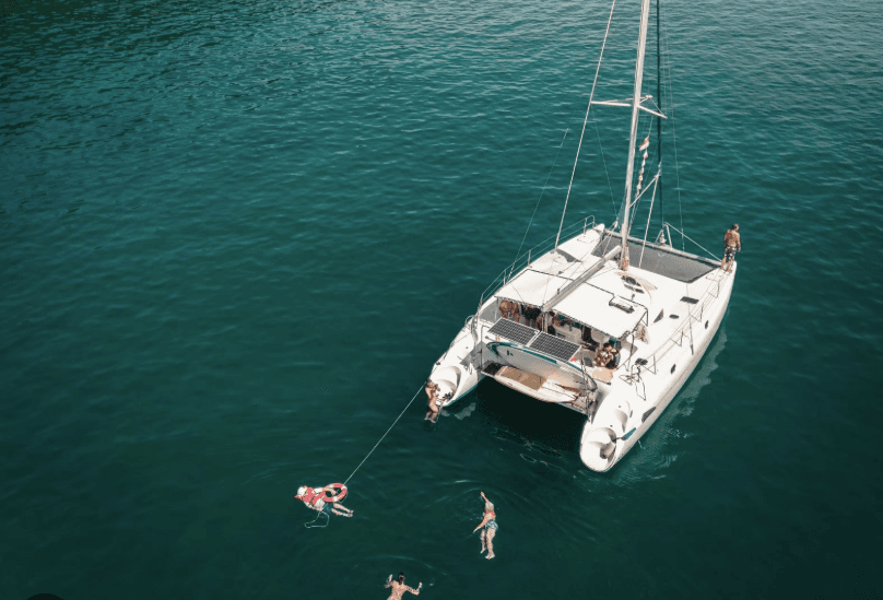 luxury catamaran swimming aerial view